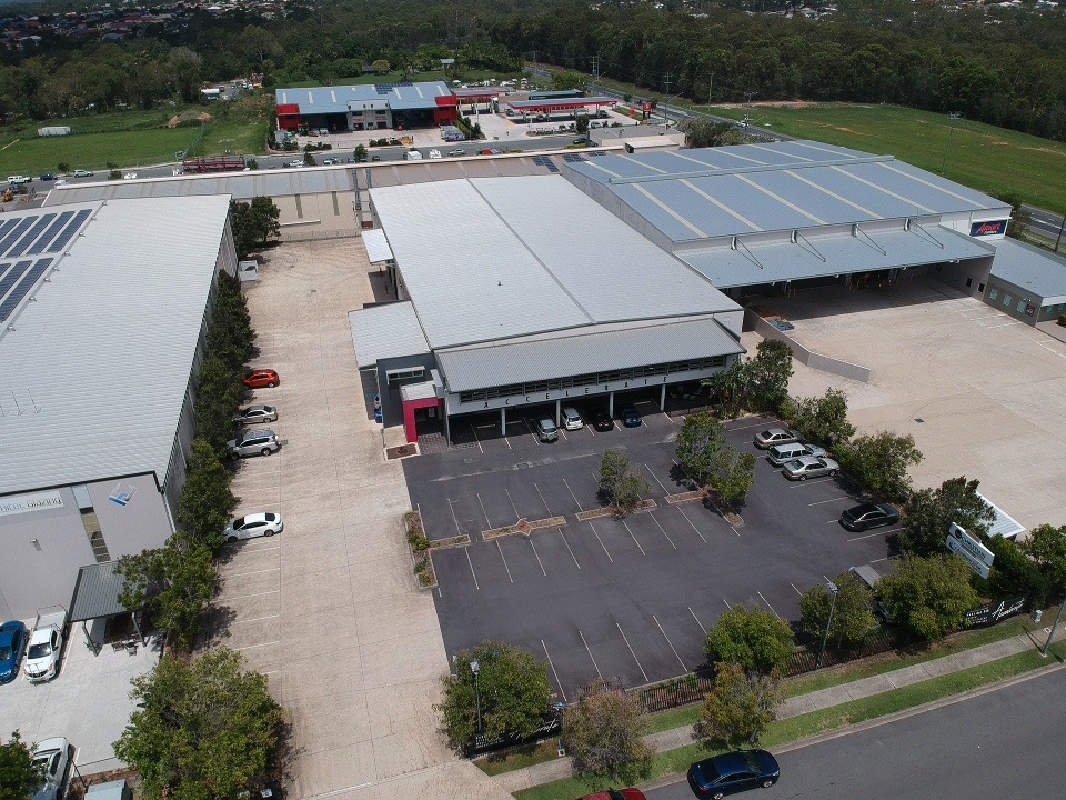 Accelerate-building-in-the-background-taken-from-a-drone.